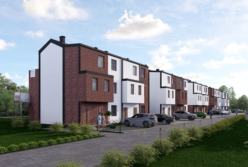 Ciąg budynków z ceglaną elewacją i miejscami postojowymi